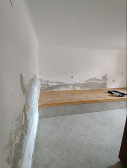 Restoration of stone walls and moisture treatment